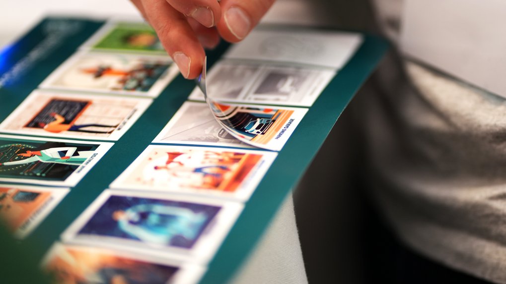 hand placing a sticker