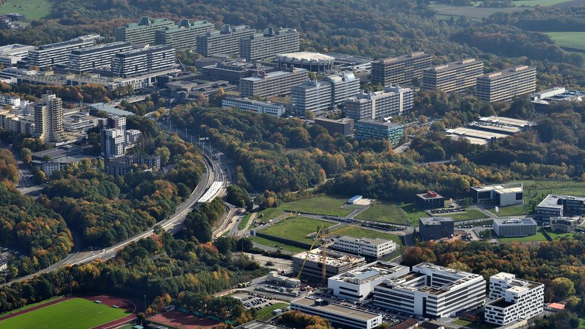 Aerial view of local universities Ruhr-Universität Bochum (in the background) and Hochschule für Gesundheit (in the foreground). Aerial view of various buildings showing the Ruhr University Bochum in the background and the University of Health in the foreground.