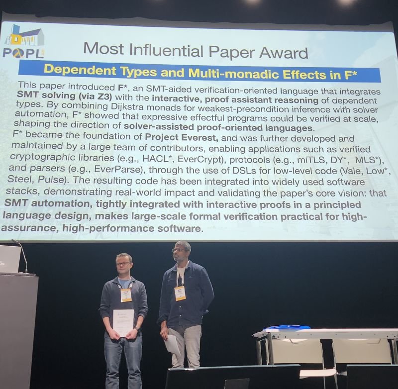 Cătălin Hrițcu (left) and Nikhil Swamy (right) at the award ceremony for the 2026 Most Influential POPL Paper Award